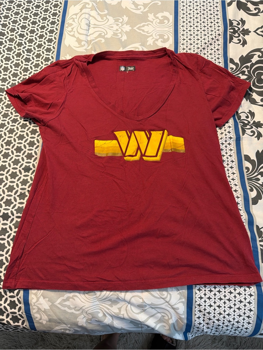 NFL Women's Maroon V-Neck Tee with Yellow Graphic